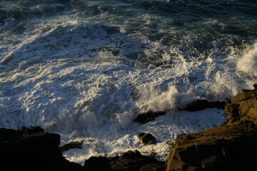 effects of waves and the ocean on the coast at sunset