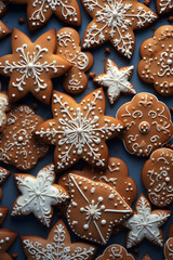 Abstract background with Christmas gingerbread pieces and cookies on gray background. Vertical composition.
