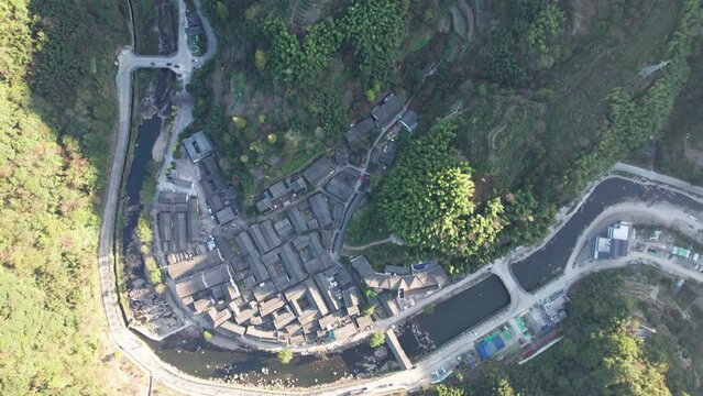 Drone view of Chinese tradition village with river around it at Ningbo, Zhejiang Province, China, 4k real time footage rising up effect.