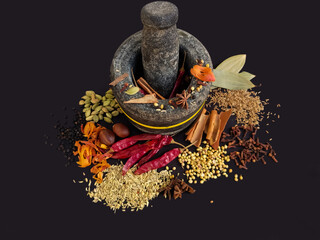 Indian traditional whole spices, dried, grounded and powdered to make curry masala or garam masala powder, used in Indian kitchen.