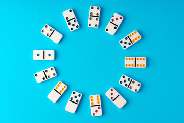 Domino tiles on blue background studio shot