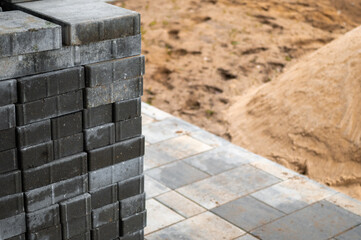 pile of tiles and sand at the construction site, outdoor shot, no people