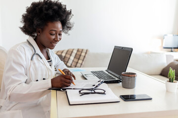 Head shot of woman wearing white coat stethoscope on shoulders looking at camera, doctor make video call interact through internet talk with patient provide help online counseling and therapy concept.