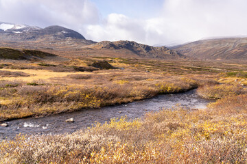 Typical landscape in Jotunheim National Park in Norway during autumn time in the Beitostølen area overlooking the Leirungsae River