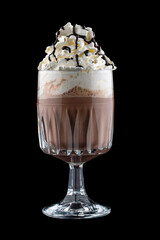 Coffee drink with cream and chocolate syrup in original glass tumbler. Isolated on a dark background