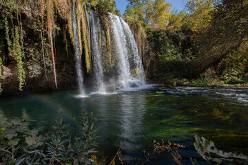Fototapeta na wymiar Upper Duden Waterfall is called as Alexander Falls as well and 10 km far from the city center. The paradise like hinterland of the waterfall is all in green in Antalya