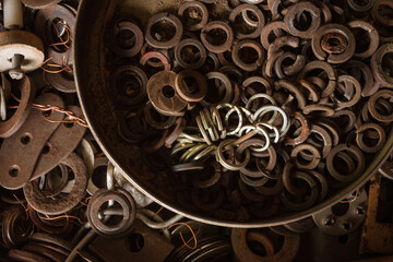 Various old nuts, washers, gaskets. Top view.