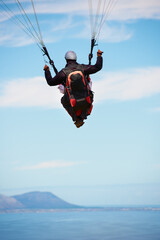 People, paragliding and freedom in sky, ocean and extreme sport with back for fitness. Coach,...