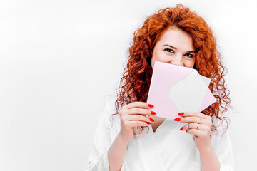 A gift certificate to a beauty salon for laser hair removal. Hair removal services, self-care and beauty. Gift certificate in the hands of a red-haired girl with glasses