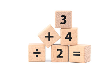 Mathematics basic proposition, numbers and operation signs in wood cubes isolated on white...