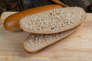 fresh wheat bread with bran on the cutting board