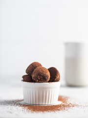 Homemade chocolate truffles with cocoa powder. Closeup view. Tasty sweet chocolate truffles