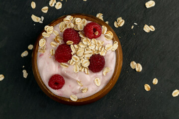 fresh yogurt with raspberry flavor and oat flakes