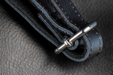 Naklejka premium the seam at the junction of two pieces of black leather
