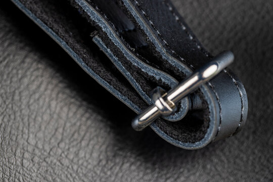 the seam at the junction of two pieces of black leather