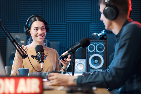 Radio host interviewing a guest in the studio