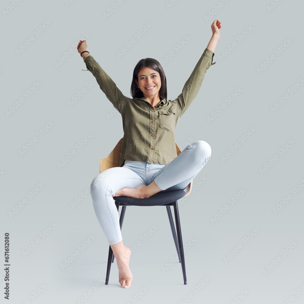 Wall mural cheerful woman celebrating with raised arms