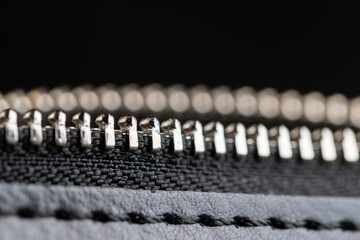zipper on a black women's handbag close-up