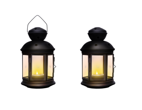 A traditional festive Christmas lantern made from black wrought iron metal glowing from a lit Christmas candle isolated against a transparent background.