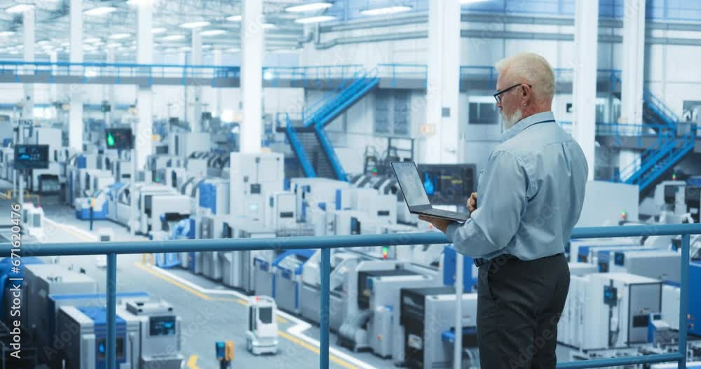 Poster Electronics Manufacturing Technician Working on a Laptop Computer at a Factory Space. Specialist Developing, Maintaining, Fine-Tuning Programs for Machine Production and Assembly