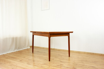 A mid century teak dining table with four chairs from the 50s 60s Danish Design Vintage Dining solid wood Modern antique 50s 60s isolated on white wall in modern living room closeup side front view