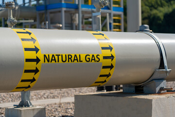 A gas pipeline with the big inscription natural gas - obrazy, fototapety, plakaty