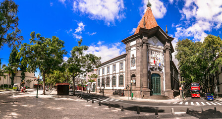 Funchal capital city of Madeira island. Central streets and square with building of Portugal Bank....