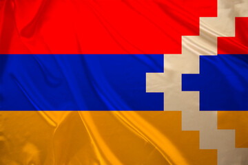 colored national flag Nagorno-Karabakh sovereignty and independence as nation on textured fabric, concept unique cultural and political identity, tourism, emigration, economy and politics