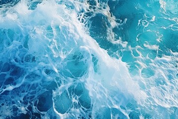 Naklejka premium Top view of bright blue clear sea wave with sea foam