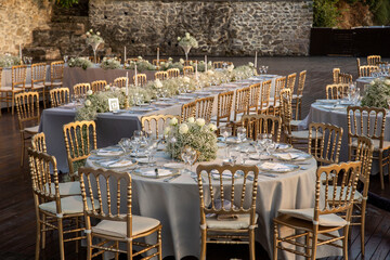 A luxurious, elegantly decorated wedding venue with a sea-view outdoor area. The decoration of the...