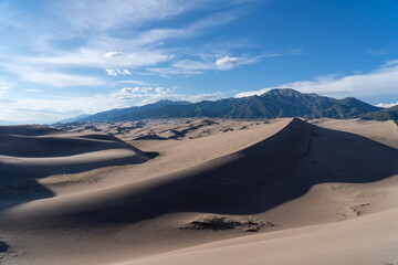 Fototapeta na wymiar Great Sand Dunes National Park in Colorado on a sunny summer day, with mountains in the background