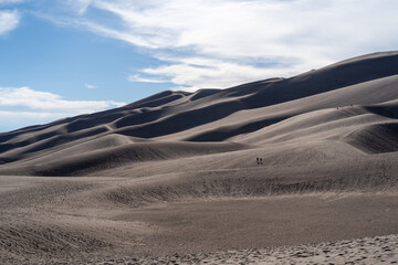 Great Sand Dunes National Park in Colorado on a sunny summer day, with mountains in the background