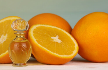 Oil essence bottle with citrus extracts. Selective focus. Spa day, concept of freshness oil bottle with lemon lime and orange.