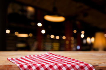 top view with red empty kitchen napkin isolated on table background. Folded cloth for mockup with copy space, Flat lay. Minimal style. High quality photo