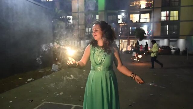 Woman with lights of fireworks. Sparkles lights. Diwali fireworks, Festival of lights. Deepawali festival. Hindu holidays. Seasonal. Firecrackers lights.