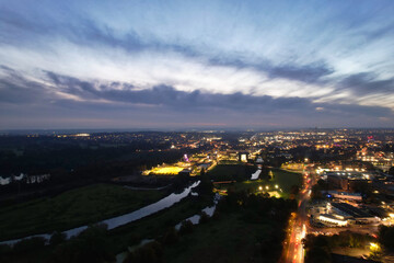 Fototapeta premium Gorgeous High Angle View of Illuminated British City at Just After Sunset