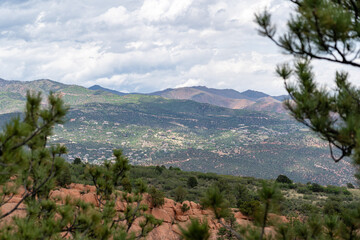 View of mountains, trees, and red rocks from Section 16 and Palmer Loop Hiking Trail in Colorado...