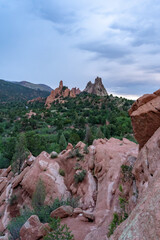 Fototapeta na wymiar A view of rock formations in Garden of the Gods around sunset, in Colorado Springs, CO on a cloudy summer evening 