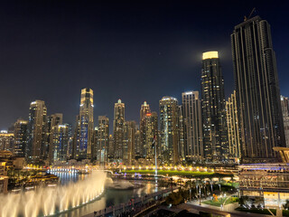 Fototapeta premium Dazzling Dubai Skyline: A symphony of steel and glass reaching new heights. Modern marvels against the desert backdrop. 