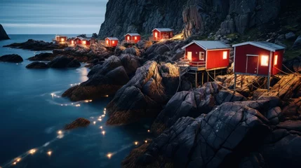Foto op Canvas Traditional red Rorbu fisherman's huts on the rocky coastline of Lofoten Islands, Norway. © sirisakboakaew