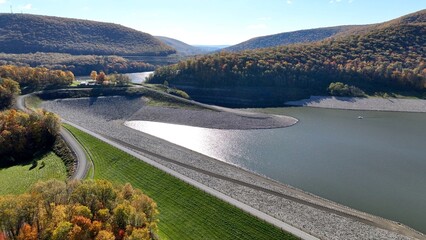 Hammond-Lakes Dam and Reservoir in Tioga, Pennsylvania peaceful lake and water in Autumn Fall colors in mountain trees in morning sunlight where boating and fishing is permitted