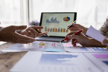 professional businessman Group of confident young businessmen analyze data using computer in a collaborative meeting discussing financial data analysis and business strategy project.