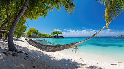 Hammock in the Caribbean tropics tropical island with coconut tree and pristine water turquoise...