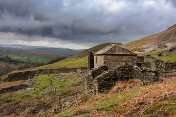 The ruins of Crackpot Hall, an 18th century farmhouse that has been abandoned to dereliction for many decades. near Keld, Upper Swaledale, North Yorkshire, UK