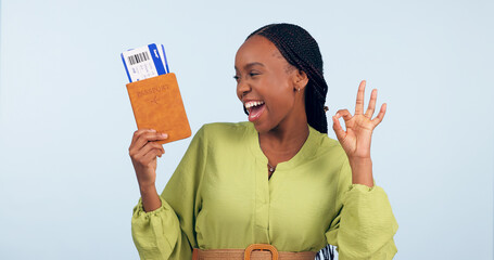 African woman, passport and studio with ok sign for airplane ticket, documents or excited smile by...
