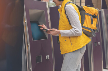 woman with backpack Buying and collecting tickets at the train station Enjoying travel concept