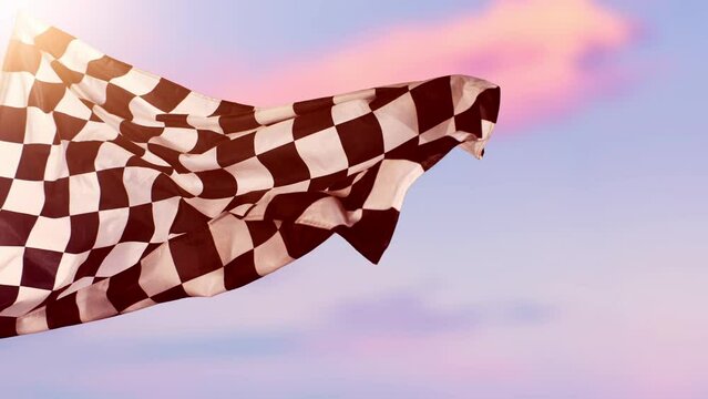 Super Slow Motion of Checkered Race Flag Waving Continuously in the Wind, 1000fps. Racing Flag with Blur Sky Background. Victory, Achievement, Success and Sport Concept.