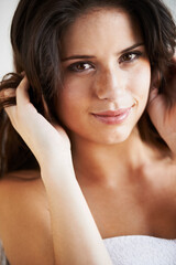 Fototapeta premium Hair care, beauty or portrait of woman after shower, cleaning or wellness routine results in studio. Hairstyle, white background or model with smile, natural skincare or healthy texture for grooming