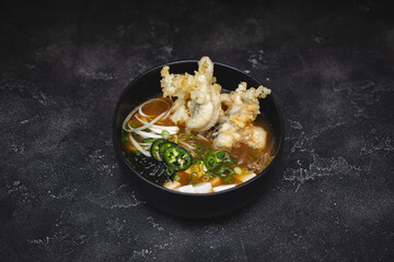 Japanese soup on a stylish dark background.