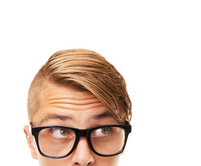 Glasses, thinking and young man in a studio with choice, looking or decision facial expression. Optometry, idea and half face of male person with spectacles or eyewear isolated by white background.